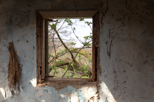 Empty window in old abandoned house