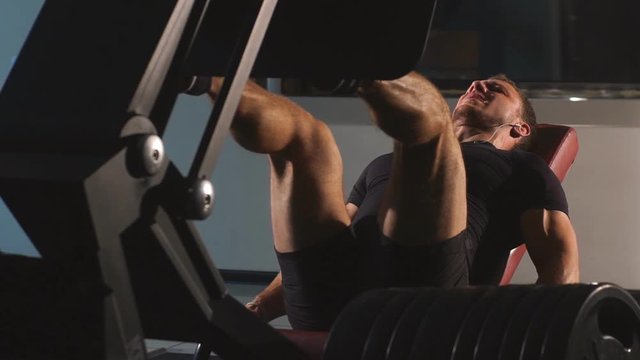 man doing leg press at the gym