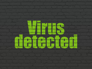 Obraz premium Protection concept: Virus Detected on wall background