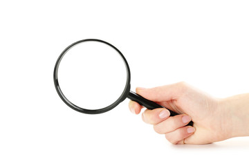 Female hand holding magnifying glass on a white background
