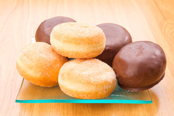 pastries filled with cream and chocolate on wooden table