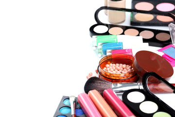 Makeup brush and cosmetics on a white background