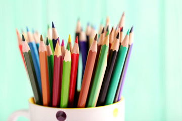 Fototapeta premium Drawing colourful pencils on a wooden background