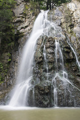 Fototapeta na wymiar Mountains stone waterfall