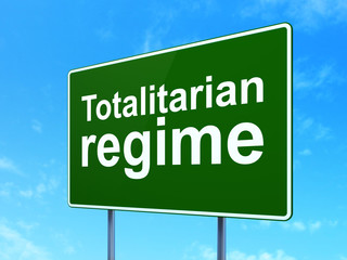 Politics concept: Totalitarian Regime on road sign background
