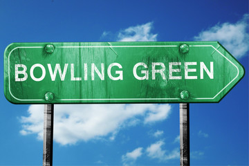 bowling green road sign , worn and damaged look