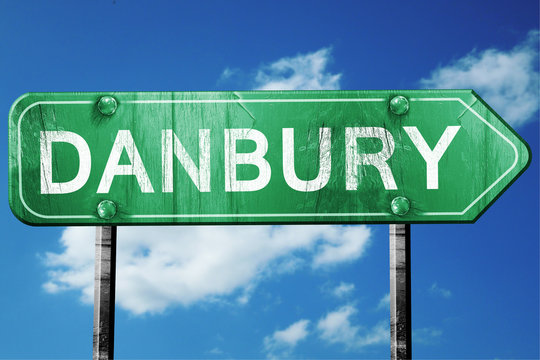 danbury road sign , worn and damaged look