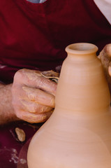 Potter modelling a clay vase