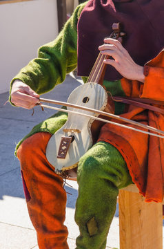 Unrecognizable Musician Playing Rebec