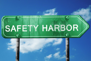 safety harbor road sign , worn and damaged look