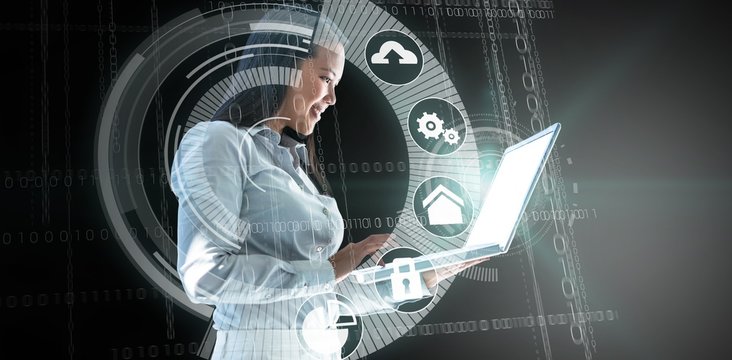 Composite image of smiling businesswoman using laptop