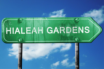 hialeah gardens road sign , worn and damaged look