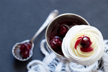 Meringue dessert with cream cheese and cherry jam