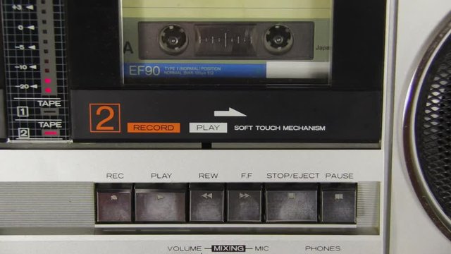 Pushing a Finger Button Rec and Stop on a Tape Recorder.