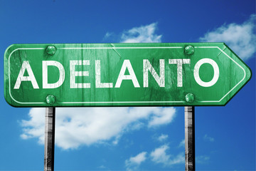 adelanto road sign , worn and damaged look