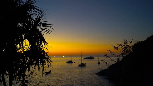 Beautiful view on the  tropical sunset sea with yachts and boats. Boats, yachts on the water surface of calm ocean.