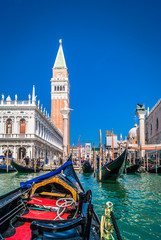 View at St. Mark's square at Venice, Italy. / Venice from gondola, a view to mail square of St Mark and toll bell tower during sunny day. 