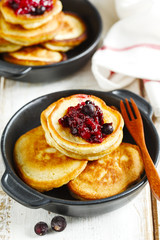 Stack of pancakes with blackcarrent jam