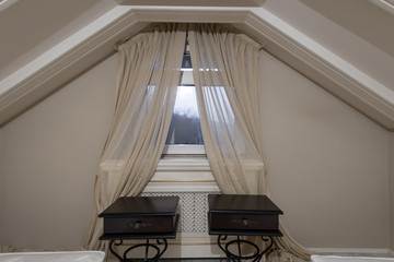 night tables in the bedroom in the attic