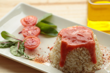 Cuban style rice on a white plate elongated