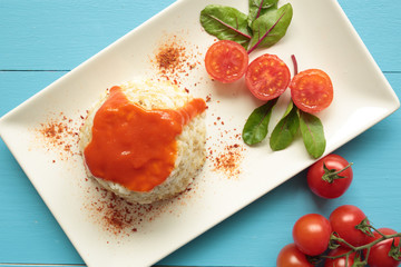 Cuban style rice on a white plate elongated