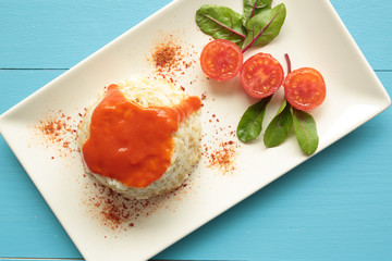 Cuban style rice on a white plate elongated