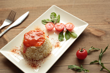 Cuban style rice on a white plate elongated