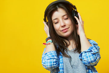 girl with eyes closed wearing headphones