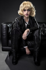 Female wearing black punk rock style leather expressing unique fashion style