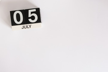 July 5th. Image of july 5 wooden color calendar on white background. Summer day. Empty space for text