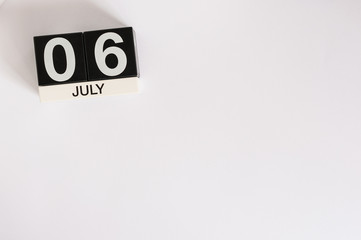 July 6th. Image of july 6 wooden color calendar on white background. Summer day. Empty space for text. World International Kiss or Kissing Day
