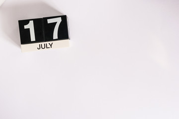 July 17th. Image of july 17 wooden color calendar on white background. Summer day. Empty space for text