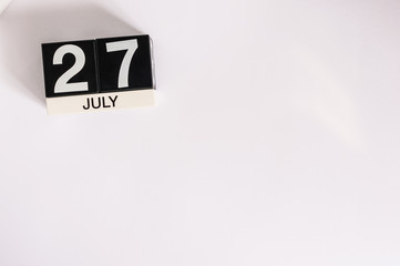 Fototapeta na wymiar July 27th. Image of july 27 wooden color calendar on white background. Summer day. Empty space for text