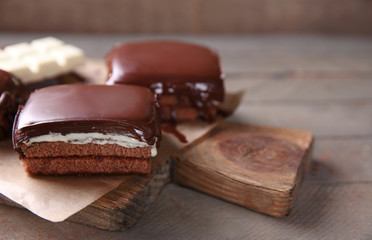 Delicious chocolate brownies on wooden background