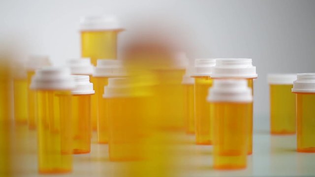 camera moves from bottles with medicine. Shot with slider.
