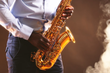 Fototapeta na wymiar African American jazz musician playing the saxophone, closeup