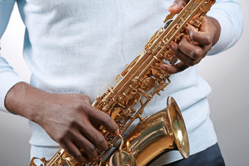 Obraz premium African American jazz musician playing the saxophone, closeup