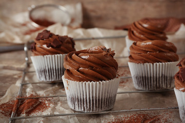 Chocolate cupcakes on paper background