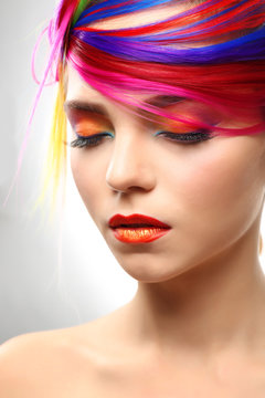 Beautiful girl with colorful makeup and hairstyle