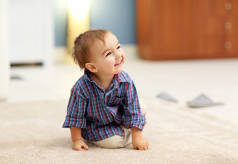 Cute baby on the floor in the room