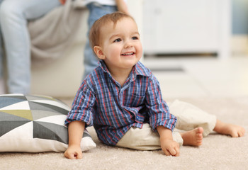 Fototapeta premium Cute baby on the floor in the room