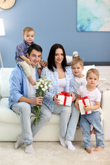 Family concept. Father with sons greeting mother, close up