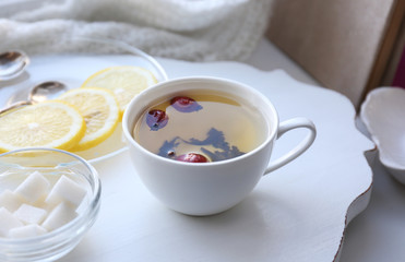 Tea set on a white wooden tray, closeup