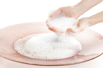 Woman washing hands in bowl isolated on white