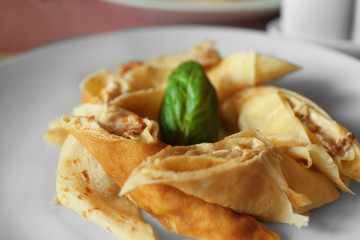Tasty pancakes on plate in cafe, close up