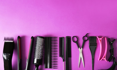 Hairdresser set with various accessories on violet background