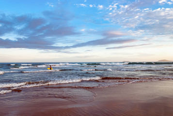 Active people walking on beach in Buzios Brazil