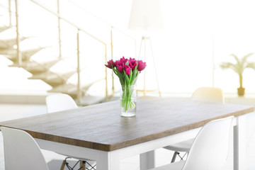Beautiful comfortable modern interior with table and chairs