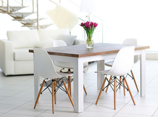 Beautiful comfortable modern interior with table and chairs