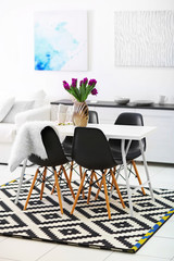 Beautiful comfortable modern interior with table and chairs
